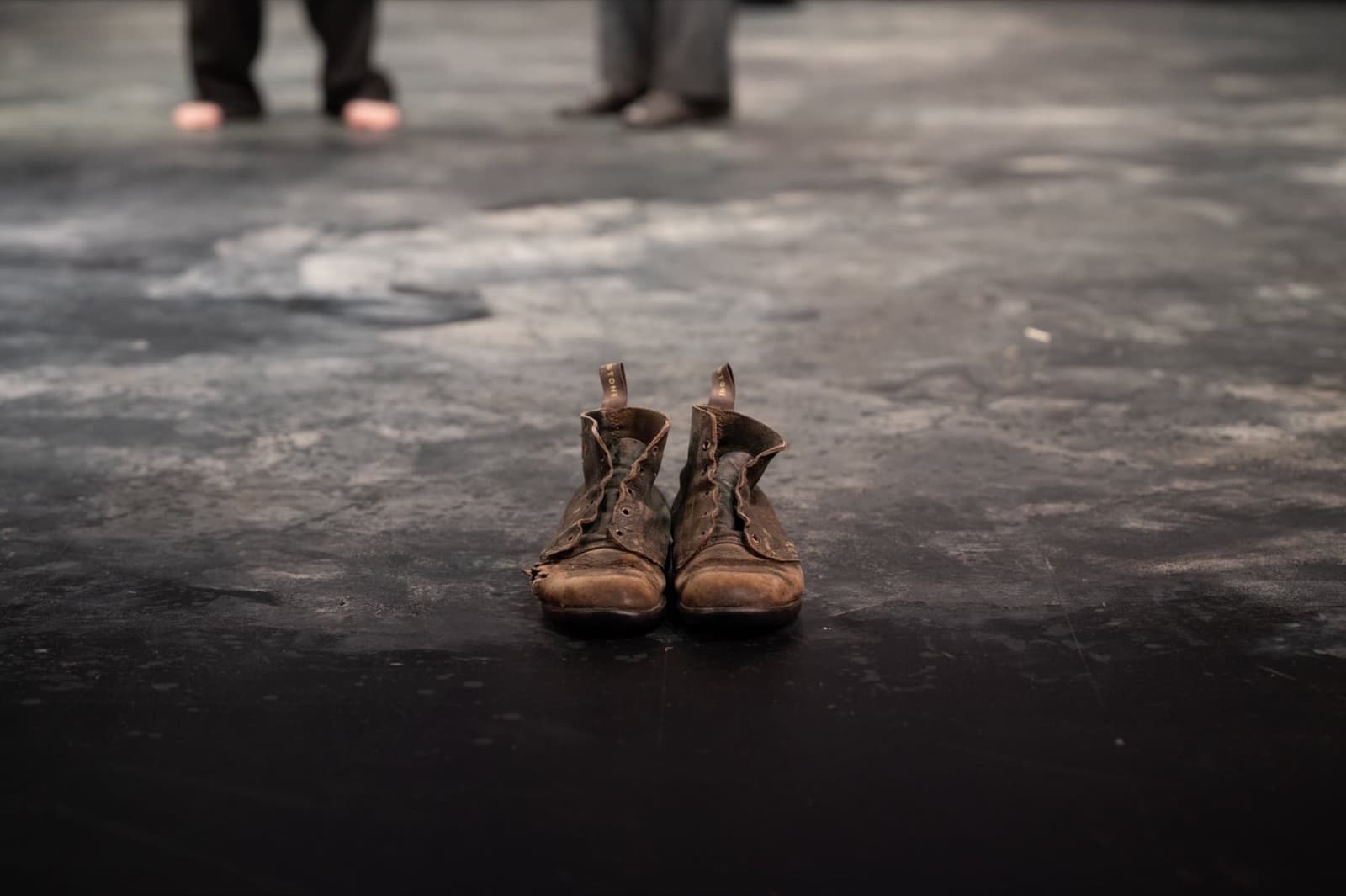 Estragon's worn leather boots left on the stage floor