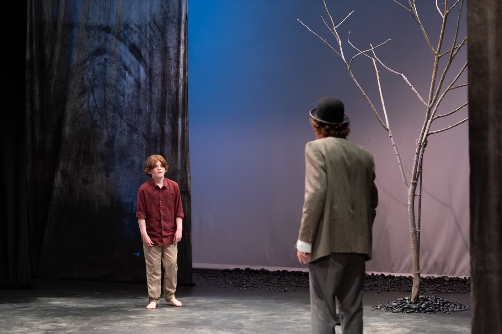 The Boy stands facing Vladimir beside the bare tree