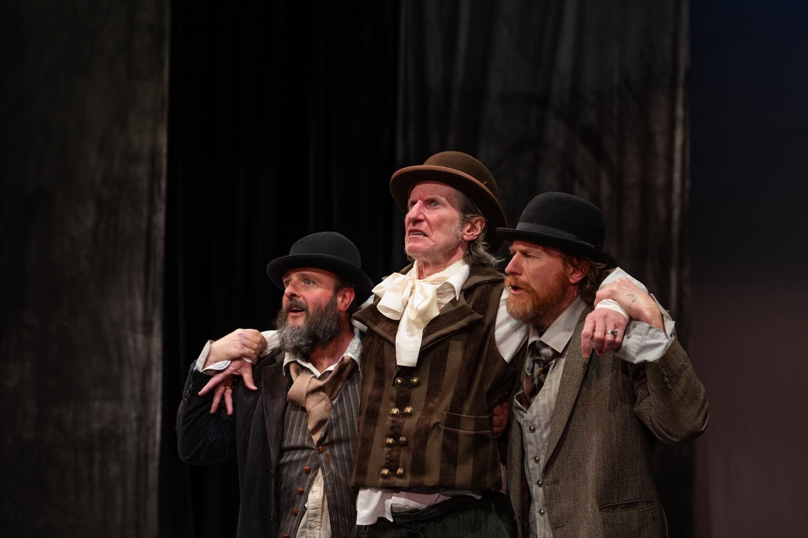 Pozzo held up between Estragon and Vladimir, arms around each other's shoulders